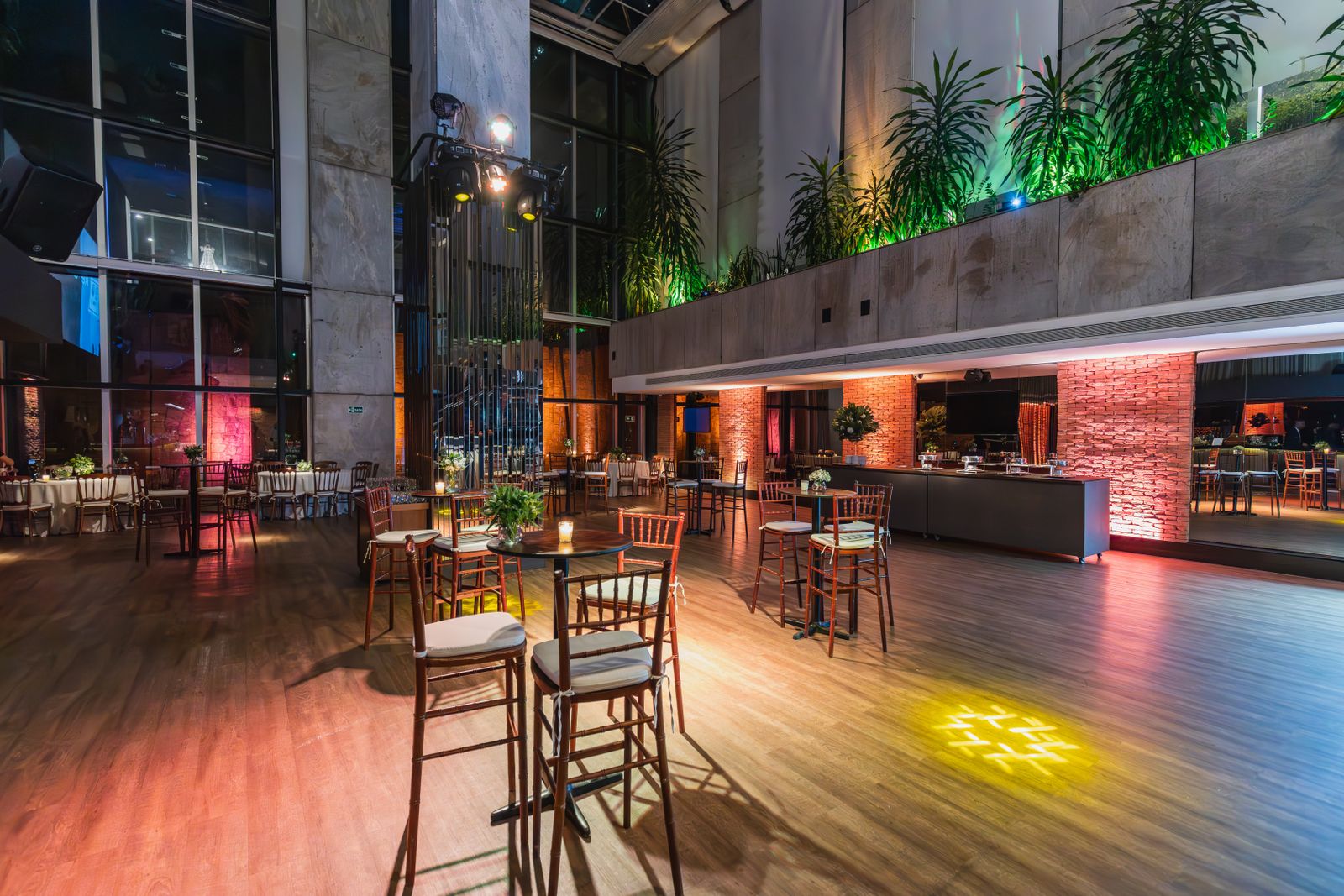Prepared corporate gala venue with tables and event lighting