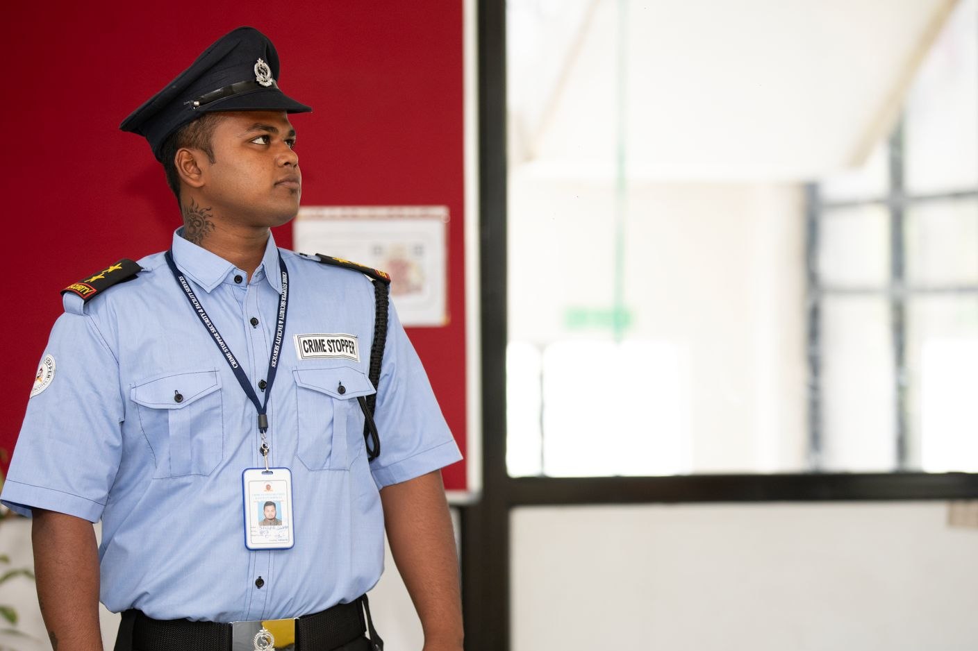 Professional security guard assigned to a private venue entrance