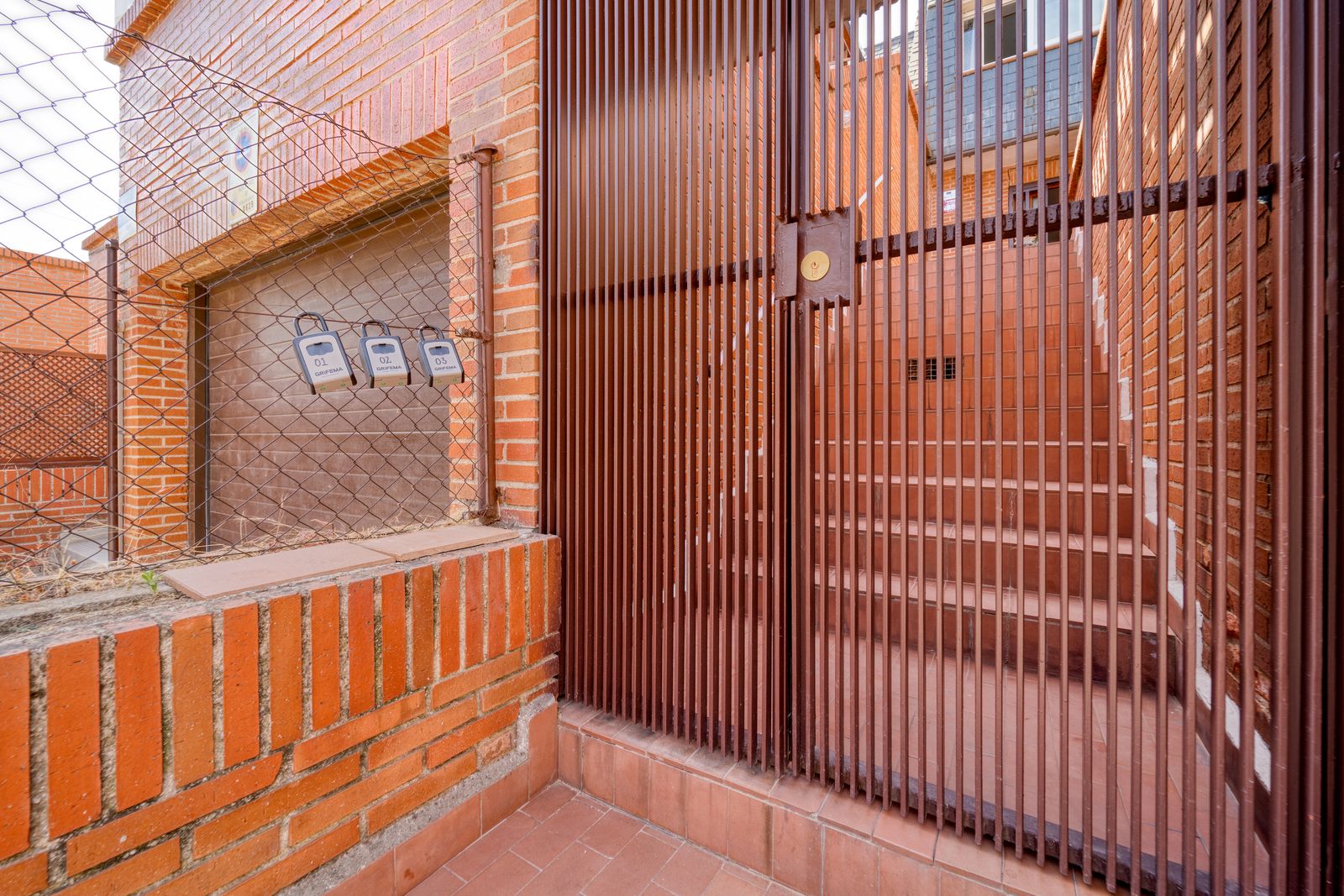 Locked metal gate at a secured residential entrance