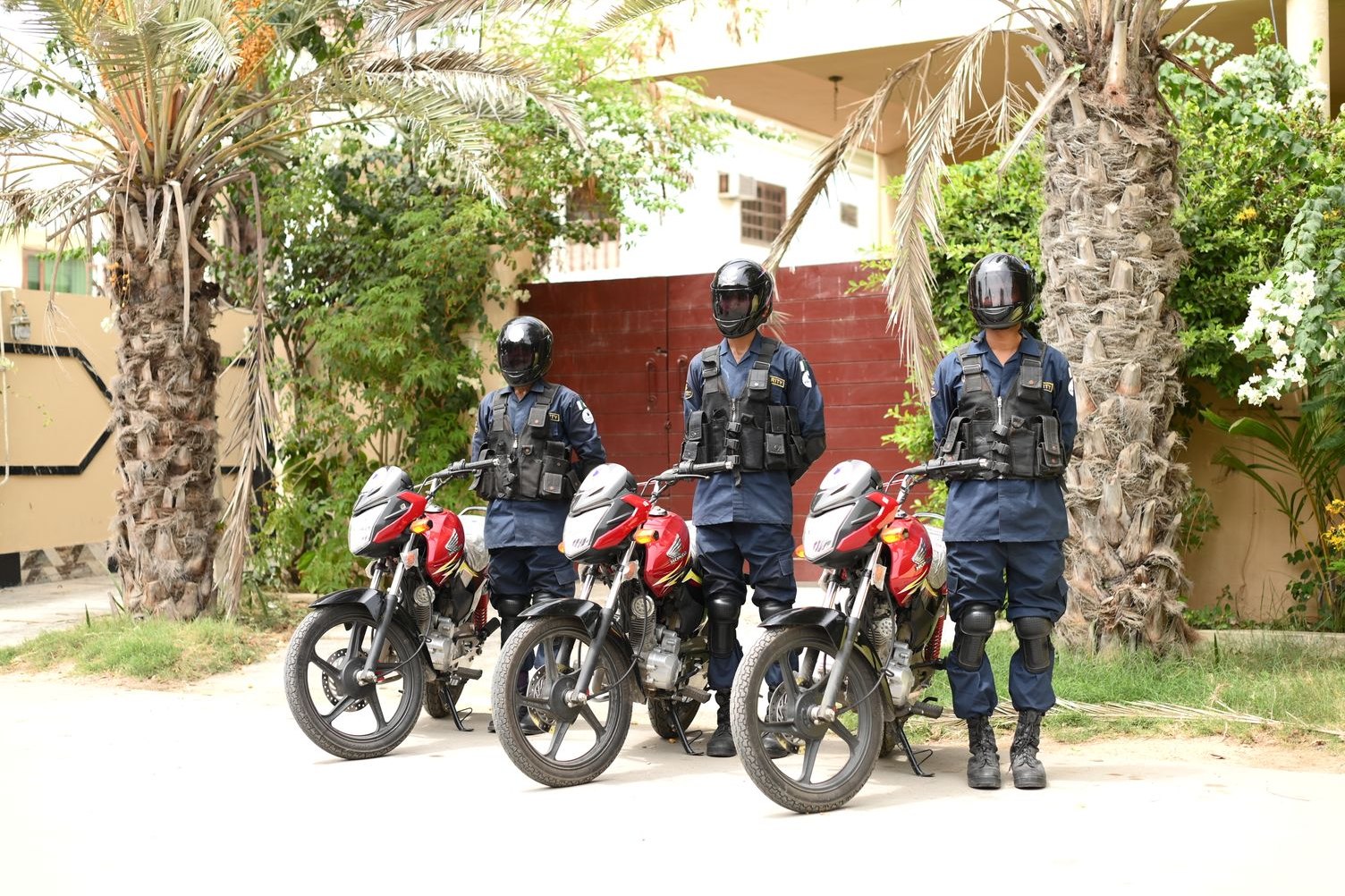 Uniformed security patrol team with motorcycles